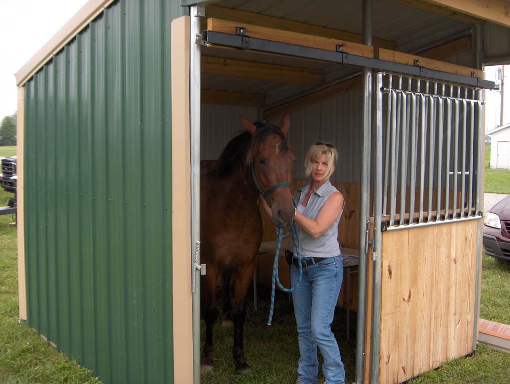 Judy and Midnight in a Klene Pipe run in horse shelter